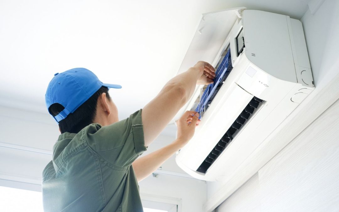 Air conditioning technician maintaining an indoor mini split system in Layton, UT